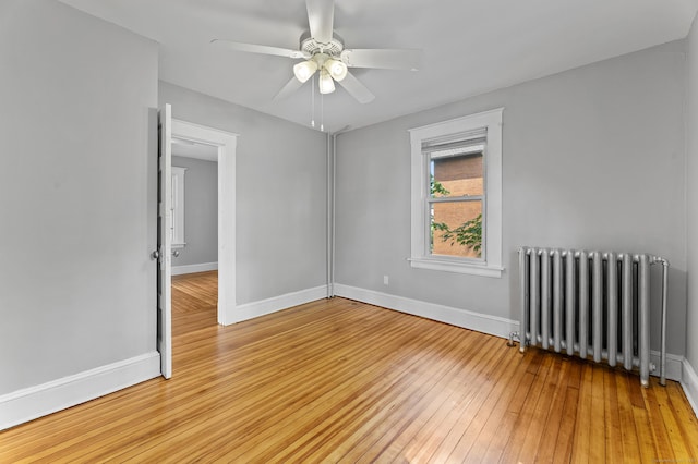 471 New Britain Rd, Berlin, CT 06037 - empty room featuring radiator, wood-type flooring, and a ceiling fan