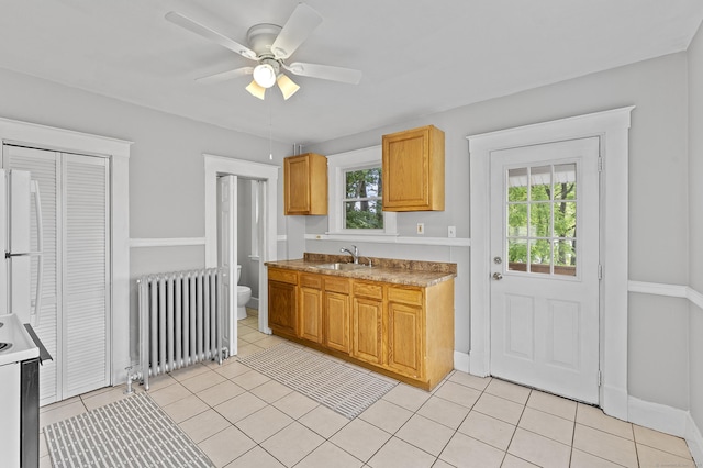 471 New Britain Rd, Berlin, CT 06037 - kitchen featuring radiator, light tile patterned flooring, ceiling fan, and white appliances