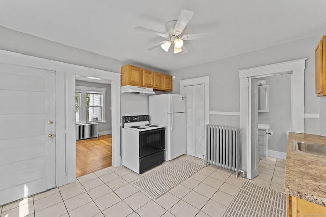 471 New Britain Rd, Berlin, CT 06037 - kitchen featuring electric range, radiator heating unit, freestanding refrigerator, and under cabinet range hood