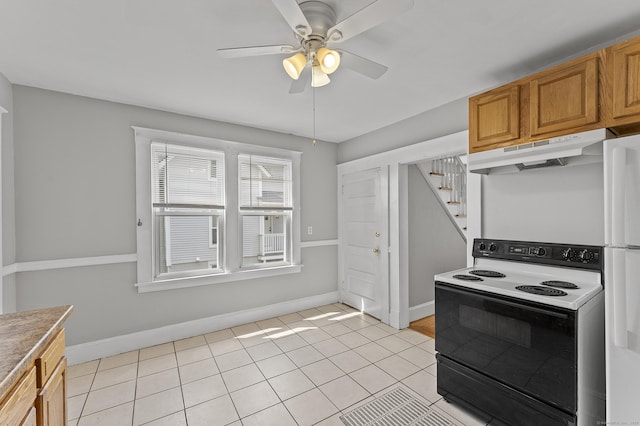 471 New Britain Rd, Berlin, CT 06037 - kitchen featuring range with electric cooktop, under cabinet range hood, ceiling fan, brown cabinets, and light tile patterned floors