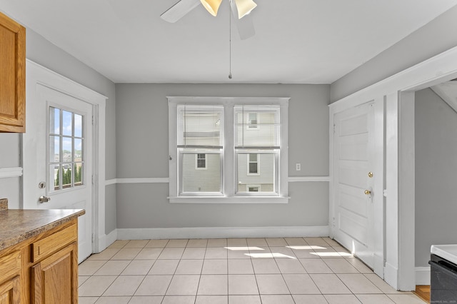 471 New Britain Rd, Berlin, CT 06037 - unfurnished dining area featuring a ceiling fan and light tile patterned flooring