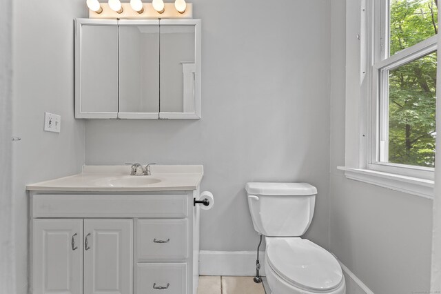 471 New Britain Rd, Berlin, CT 06037 - half bathroom featuring vanity, plenty of natural light, and tile patterned floors