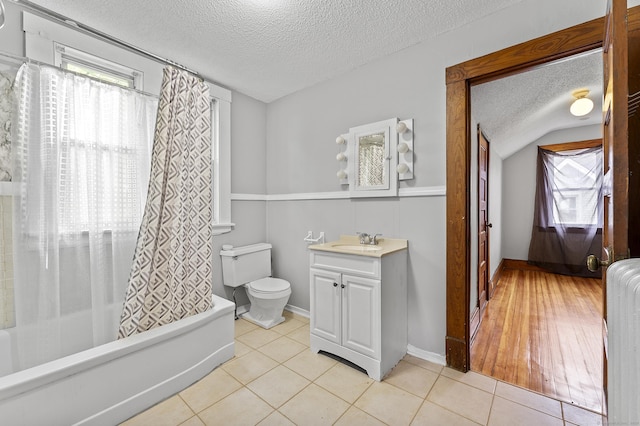 471 New Britain Rd, Berlin, CT 06037 - bathroom featuring a textured ceiling, vanity, plenty of natural light, shower / bathtub combination with curtain, and tile patterned flooring