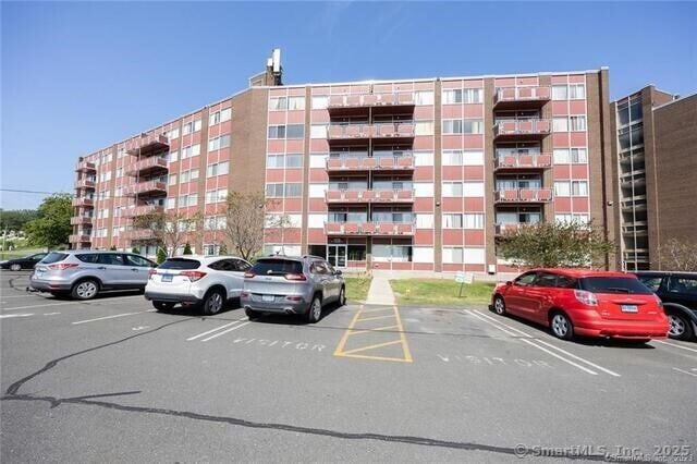 1310 Berlin Tpke Apt 525, Wethersfield, CT 06109 - view of apartment building / complex with uncovered parking