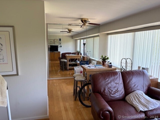 1310 Berlin Tpke Apt 525, Wethersfield, CT 06109 - living area featuring a ceiling fan and wood finished floors