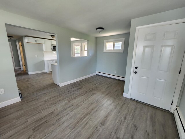 84 May St, New Britain, CT 06052 - spare room with baseboard heating, wood finished floors, and baseboards