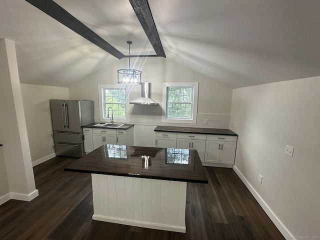 22 Hemlock Trl, Newtown, CT 06482 - kitchen with wall chimney exhaust hood, freestanding refrigerator, a sink, dark wood finished floors, and backsplash