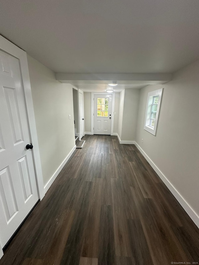 22 Hemlock Trl, Newtown, CT 06482 - unfurnished living room with dark wood-type flooring and baseboards