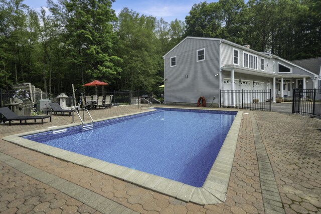 1729 Litchfield Rd, Watertown, CT 06795 - view of pool featuring a patio area and view of wooded area
