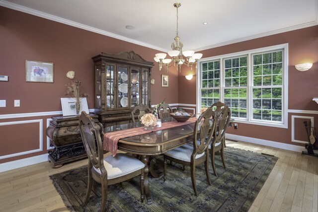 1729 Litchfield Rd, Watertown, CT 06795 - dining room with a chandelier, ornamental molding, light wood-style floors, and wainscoting