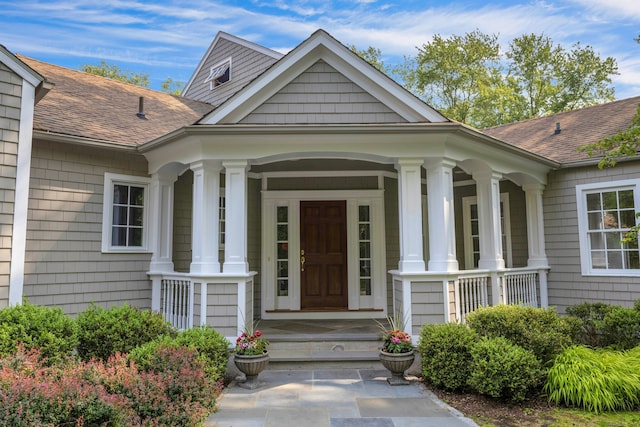 4 The Fenway, Westport, CT 06880 - doorway to property featuring a porch and roof with shingles