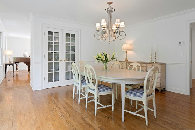 4 The Fenway, Westport, CT 06880 - dining space featuring wood finished floors, a chandelier, french doors, and ornamental molding