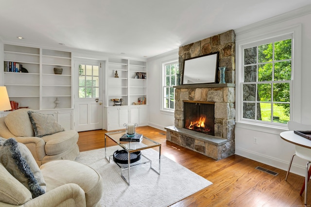 4 The Fenway, Westport, CT 06880 - living area with plenty of natural light, a fireplace, ornamental molding, and wood finished floors