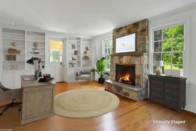 4 The Fenway, Westport, CT 06880 - living area with a fireplace, a desk, crown molding, wood finished floors, and built in shelves