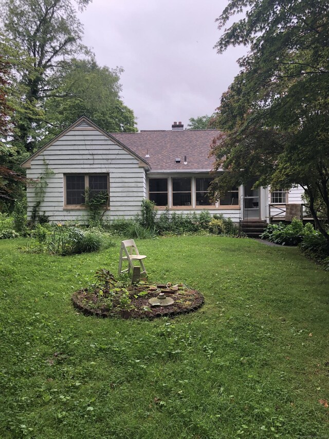 50 Richard Dr, Hamden, CT 06514 - rear view of house featuring a yard and a chimney