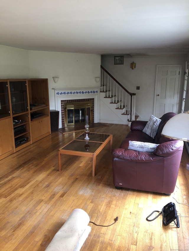 50 Richard Dr, Hamden, CT 06514 - living room featuring hardwood / wood-style flooring, a fireplace, and stairway