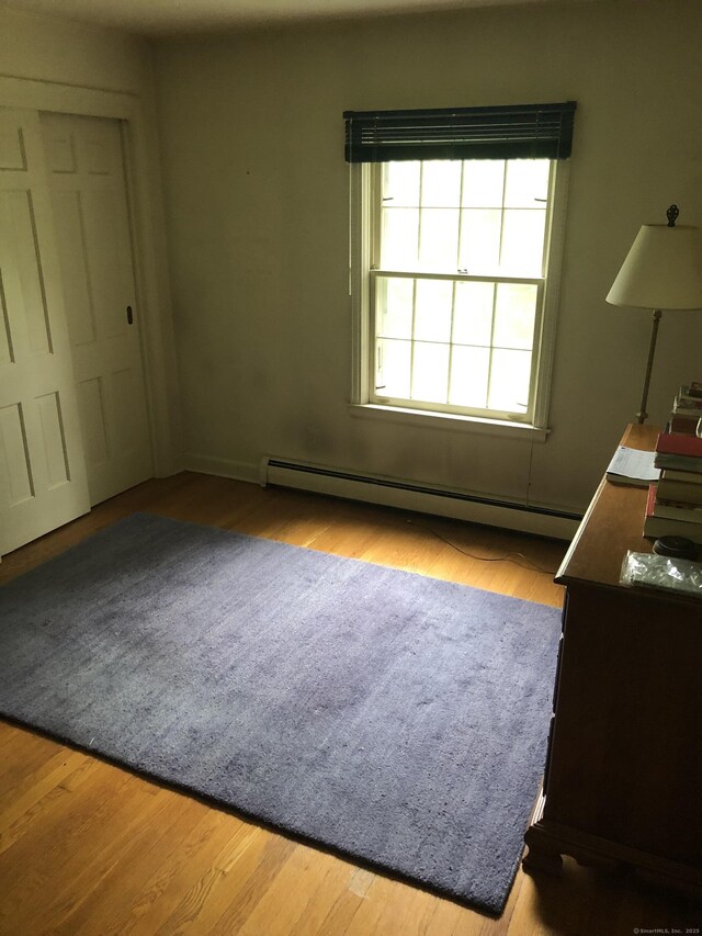 50 Richard Dr, Hamden, CT 06514 - bedroom featuring baseboard heating and wood finished floors