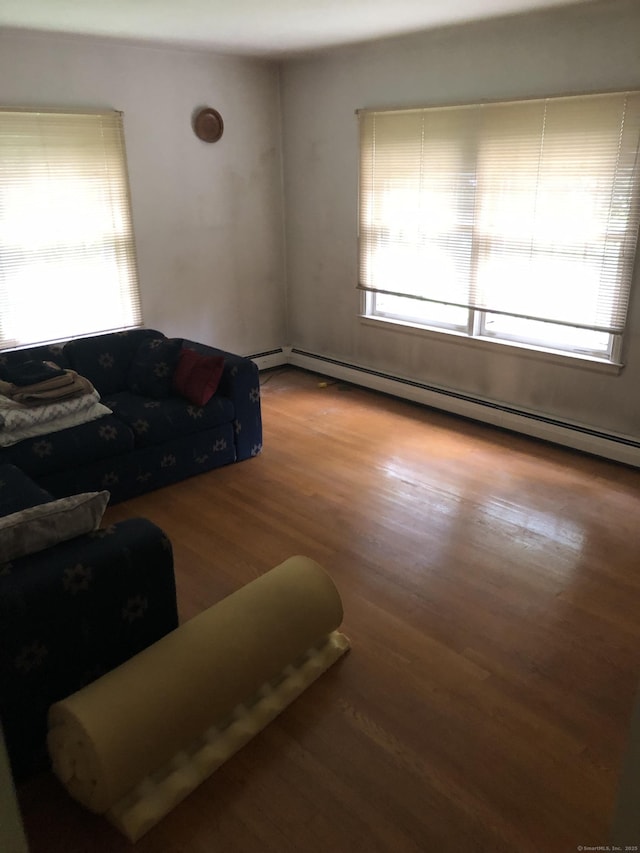 50 Richard Dr, Hamden, CT 06514 - living area featuring a baseboard heating unit and wood finished floors