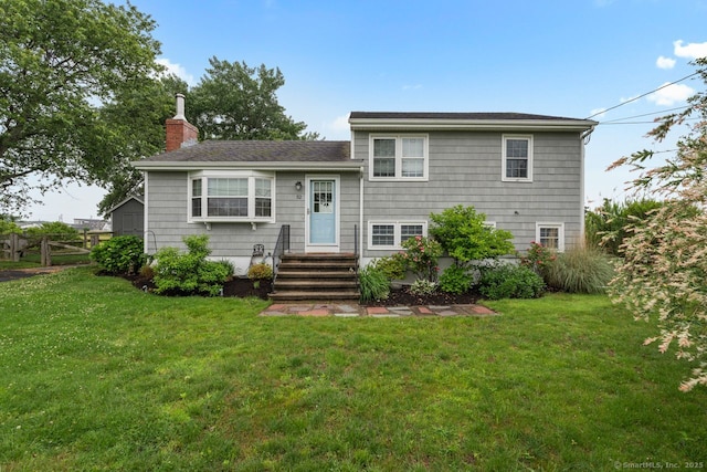 52 Seaside Ave, Guilford, CT 06437 - split level home with a chimney and a front lawn
