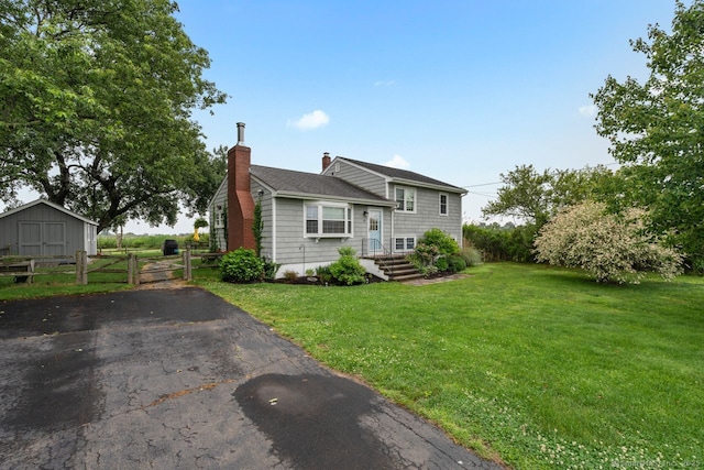 52 Seaside Ave, Guilford, CT 06437 - split level home with a chimney, a gate, and a shingled roof