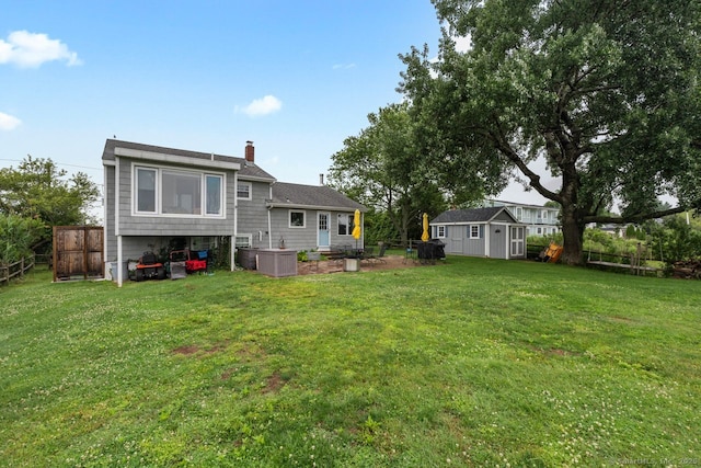 52 Seaside Ave, Guilford, CT 06437 - back of house featuring a storage unit and a chimney