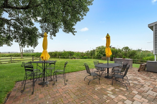 52 Seaside Ave, Guilford, CT 06437 - fenced backyard featuring outdoor dining space and a patio