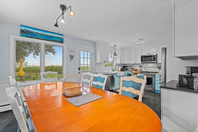 52 Seaside Ave, Guilford, CT 06437 - dining room with track lighting and dark tile patterned flooring