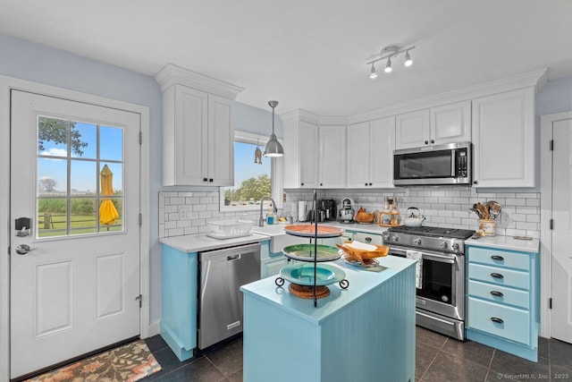 52 Seaside Ave, Guilford, CT 06437 - kitchen with appliances with stainless steel finishes, white cabinets, light countertops, and tasteful backsplash