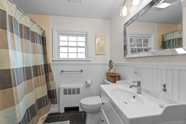 52 Seaside Ave, Guilford, CT 06437 - full bath featuring radiator, tile patterned floors, wainscoting, vanity, and a shower with curtain