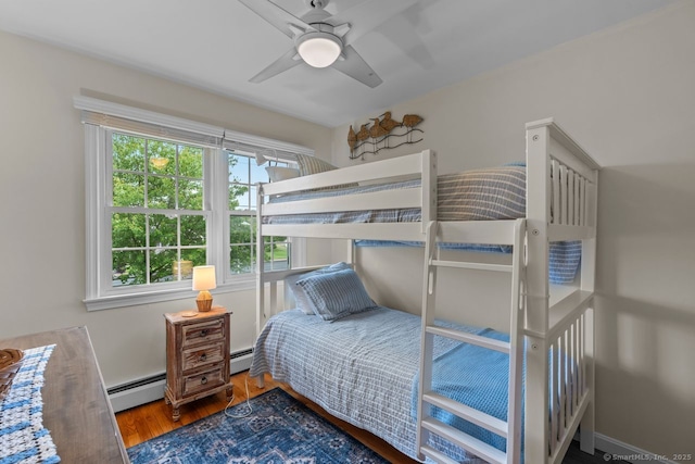 52 Seaside Ave, Guilford, CT 06437 - bedroom featuring a baseboard radiator, wood finished floors, and ceiling fan
