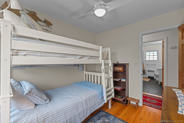 52 Seaside Ave, Guilford, CT 06437 - bedroom featuring radiator, wood finished floors, and ceiling fan