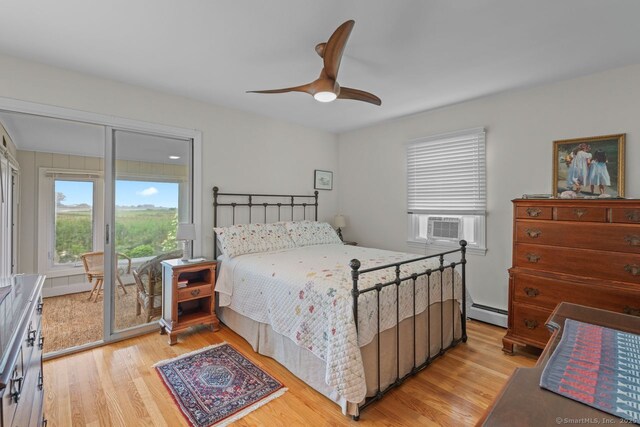 52 Seaside Ave, Guilford, CT 06437 - bedroom featuring access to exterior, light wood-style floors, a baseboard radiator, and a ceiling fan
