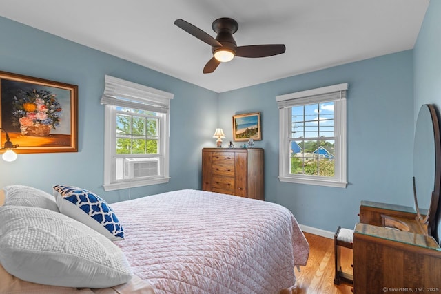 52 Seaside Ave, Guilford, CT 06437 - bedroom with wood finished floors, a ceiling fan, and cooling unit