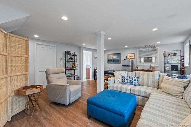52 Seaside Ave, Guilford, CT 06437 - living area with wood finished floors, recessed lighting, and cooling unit