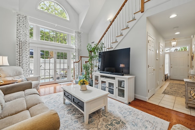 67 Southwick Ct Unit 67, Cheshire, CT 06410 - living area featuring high vaulted ceiling, light wood-type flooring, recessed lighting, and stairway
