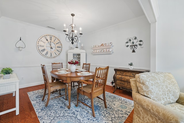 67 Southwick Ct Unit 67, Cheshire, CT 06410 - dining area with a chandelier, wood finished floors, and crown molding