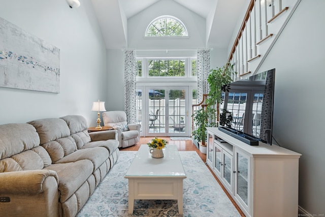 67 Southwick Ct Unit 67, Cheshire, CT 06410 - living room with high vaulted ceiling and light wood-type flooring