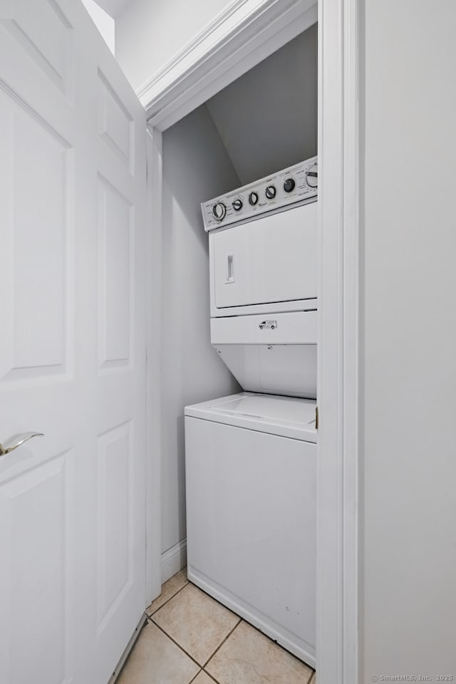 67 Southwick Ct Unit 67, Cheshire, CT 06410 - laundry area featuring stacked washing machine and dryer and light tile patterned floors