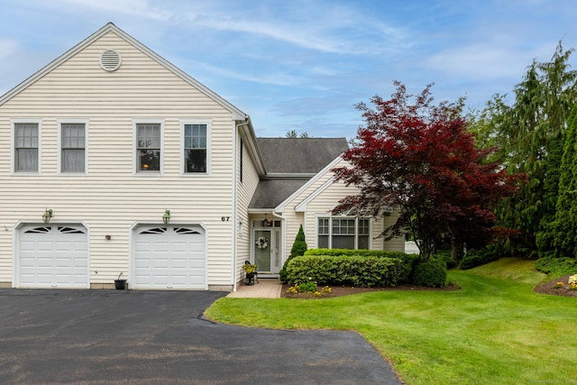 67 Southwick Ct Unit 67, Cheshire, CT 06410 - view of front of home with asphalt driveway, a front yard, and a garage