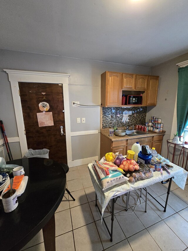 516 Dixwell Ave, New Haven, CT 06511 - kitchen with light tile patterned flooring, tasteful backsplash, and light countertops