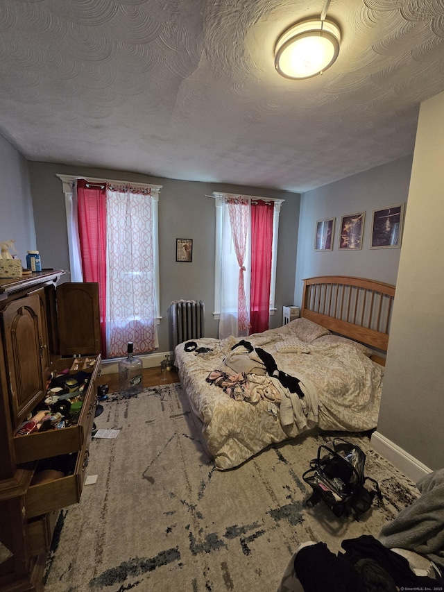 516 Dixwell Ave, New Haven, CT 06511 - bedroom with radiator and a textured ceiling