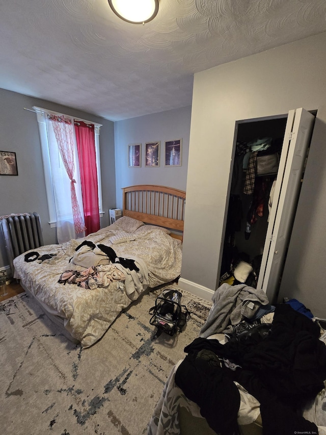 516 Dixwell Ave, New Haven, CT 06511 - bedroom with baseboards and radiator