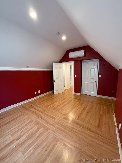 246 Sheffield Ave, New Haven, CT 06511 - bonus room with a wall unit AC, lofted ceiling, and light wood finished floors