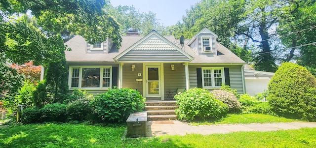 4 Tryon Rd, Norwalk, CT 06851 - view of front of house featuring covered porch, a chimney, a garage, a front lawn, and roof with shingles