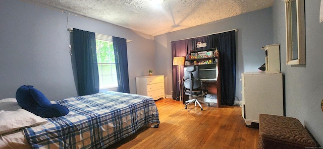 4 Tryon Rd, Norwalk, CT 06851 - bedroom with wood-type flooring and a textured ceiling