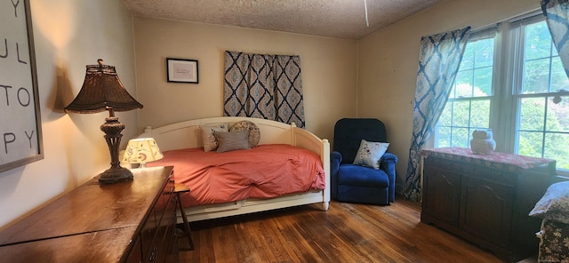 4 Tryon Rd, Norwalk, CT 06851 - bedroom featuring dark wood-type flooring, a textured ceiling, and multiple windows