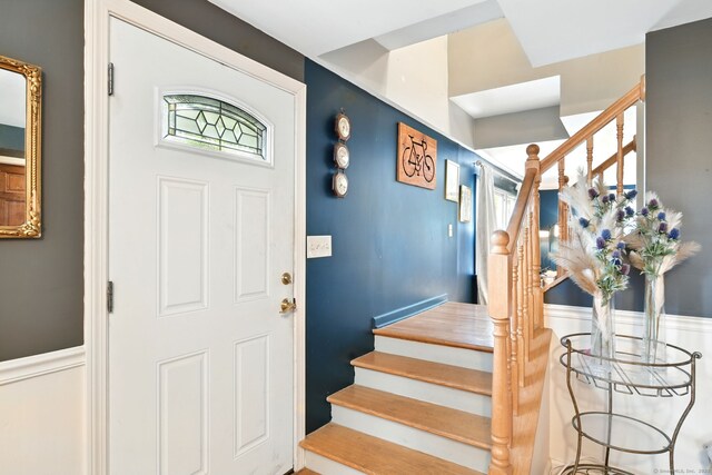 95 Lauter Ave, Windham, CT 06226 - entrance foyer featuring stairway, wainscoting, and plenty of natural light