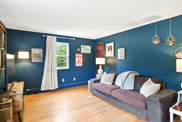 95 Lauter Ave, Windham, CT 06226 - living area featuring wood finished floors and a baseboard heating unit