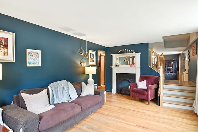 95 Lauter Ave, Windham, CT 06226 - living room featuring stairway, wood finished floors, and a fireplace