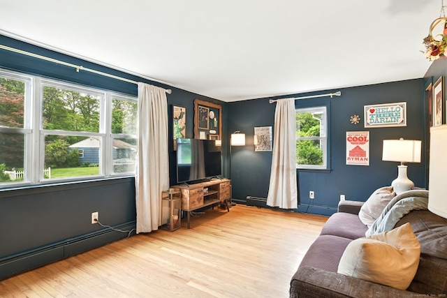 95 Lauter Ave, Windham, CT 06226 - living room featuring wood finished floors and a baseboard heating unit